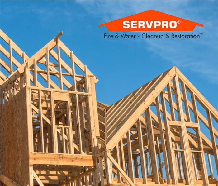 House under construction with SERVPRO logo in top right corner